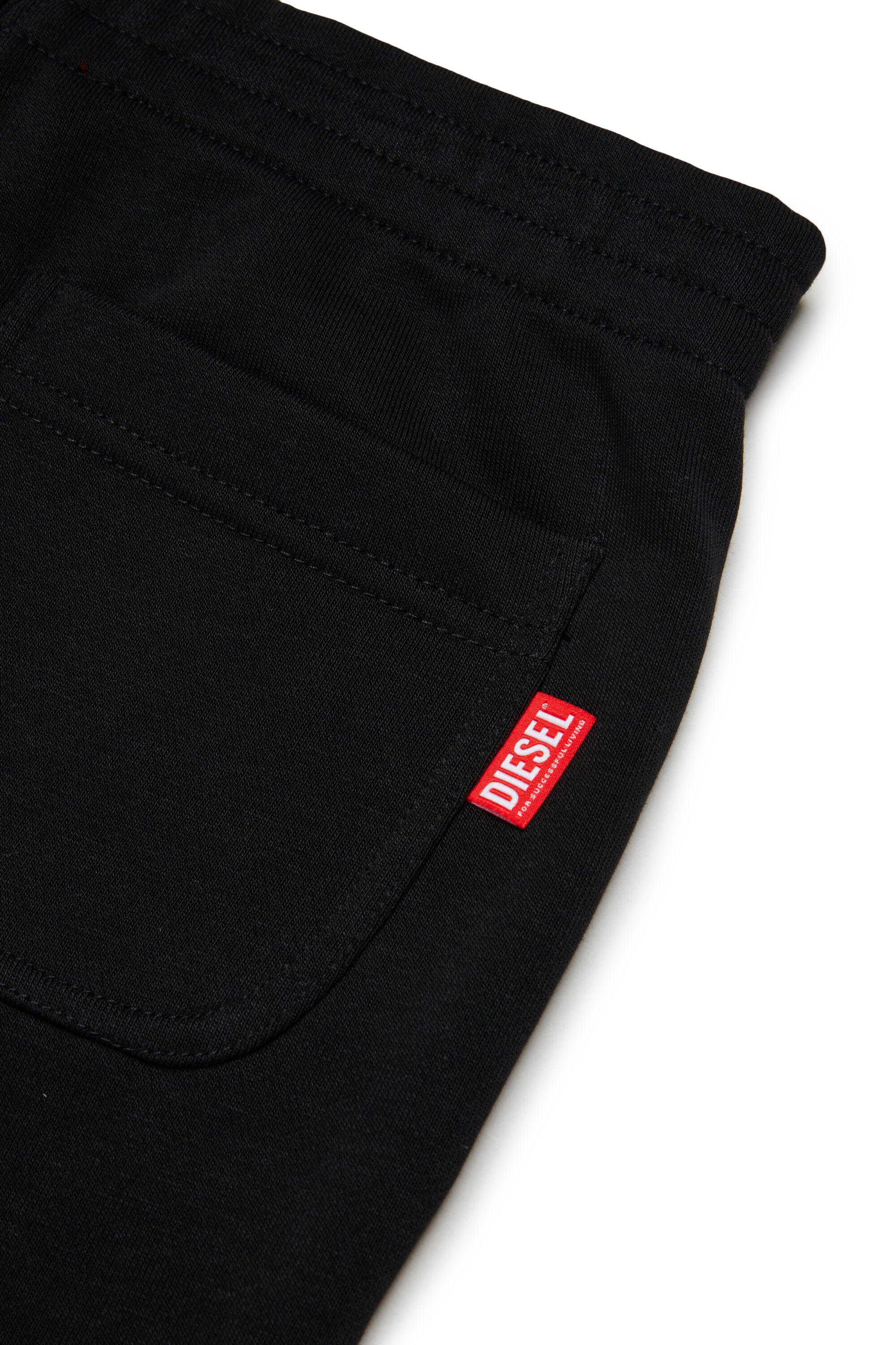 Diesel - PRES, Pantal&oacute;n de ch&aacute;ndal con logo cortado Hombre in Negro - 4