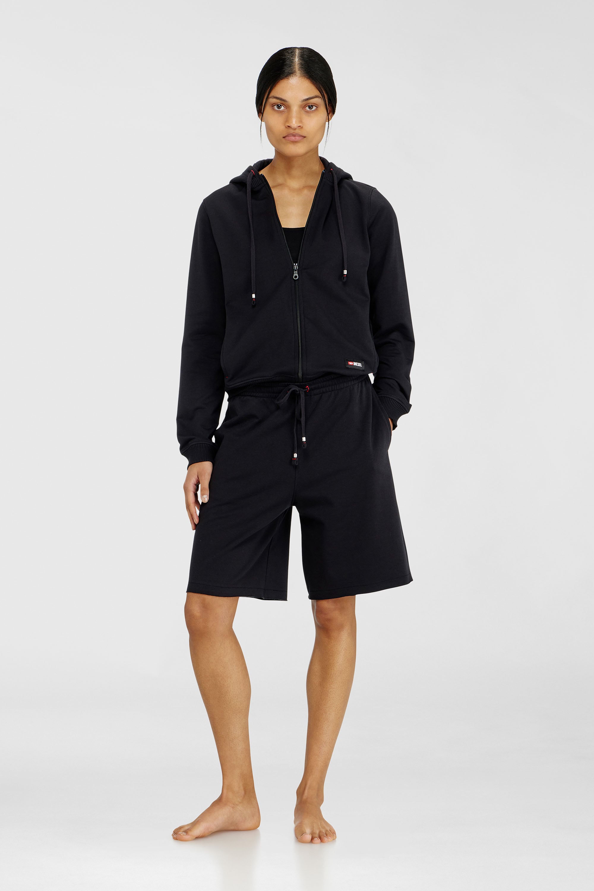 Diesel - CLARA-D-CORE, Pantalones cortos afelpado con bajos al corte Mujer in Negro - 1