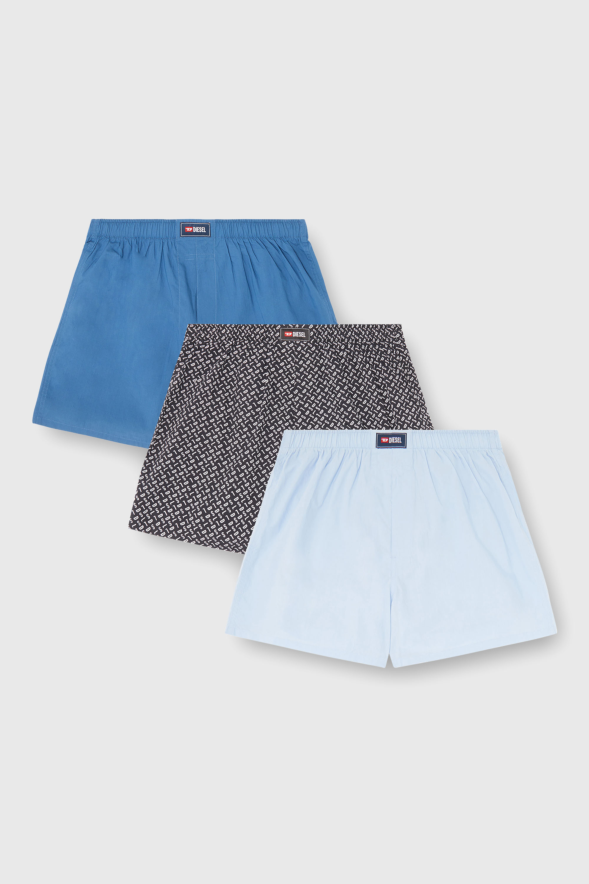 Diesel - RYAN-D-CORE-3PACK, Paquete de tres b&oacute;xers de algod&oacute;n lisos y con estampado all-over DSL Hombre in Azul marino - 1